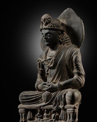 Lot 230 - A LARGE GRAY SCHIST FIGURE OF MAITREYA, ANCIENT REGION OF GANDHARA, 3RD-4TH CENTURY