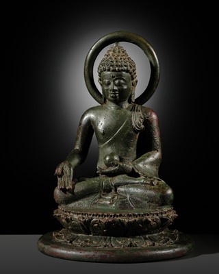 Lot 470 - A BRONZE FIGURE OF THE MEDICINE BUDDHA (BHAISAJYAGURU), CENTRAL JAVANESE PERIOD, 9TH-10TH CENTURY