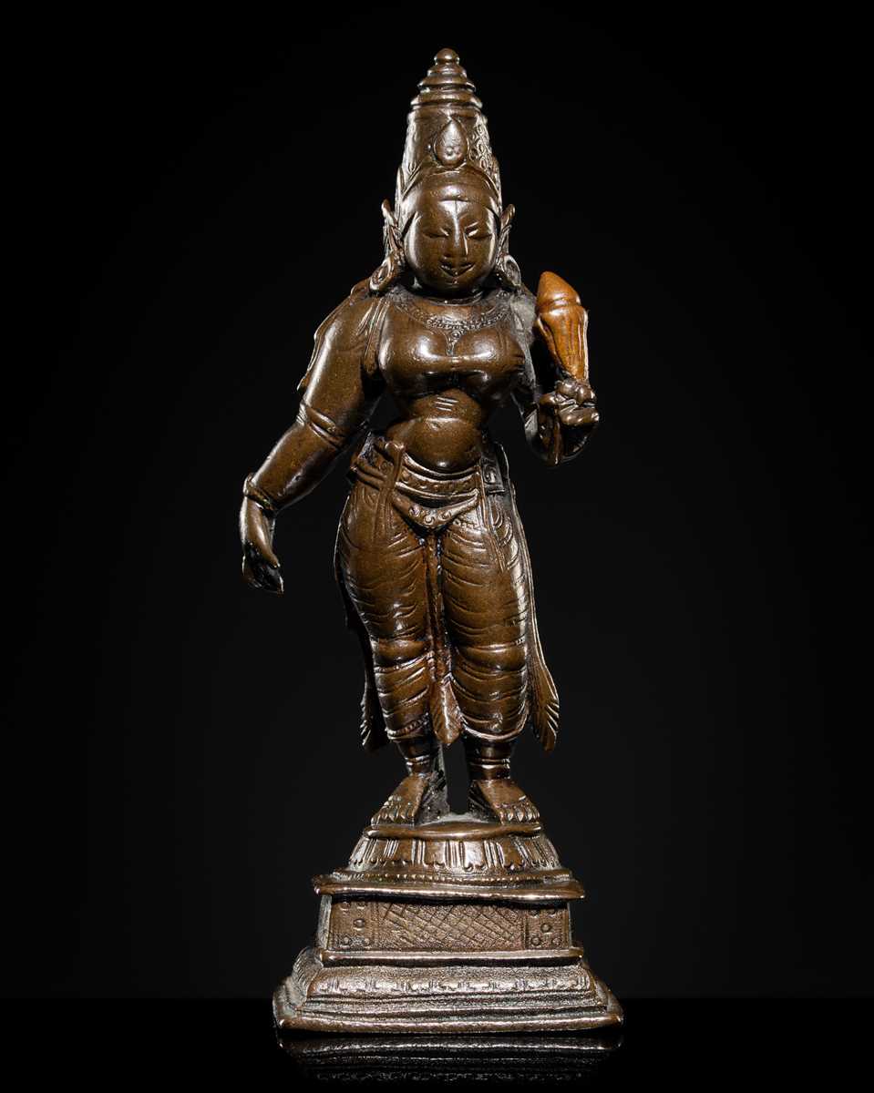 Lot 627 - A COPPER-INLAID BRONZE FIGURE OF SRI DEVI,
