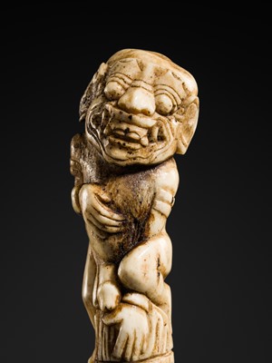 Lot 660 - AN ANTLER KRIS HILT IN THE FORM OF A MALE DEMON, INDONESIA, 18TH-19TH CENTURY