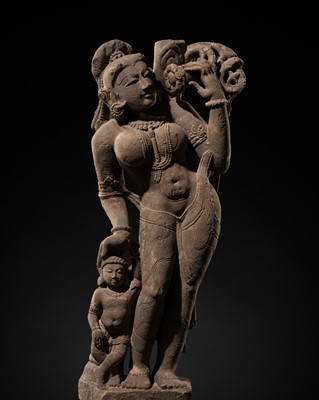 Lot 365 - A FINE GRAY SANDSTONE FIGURE OF SHALABHANJIKA, 18TH TO 19TH CENTURY OR EARLIER