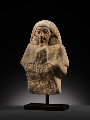 Lot 12 - A RARE EGYPTIAN SANDSTONE FRAGMENT OF A STELOPHOROUS STATUE DEPICTING AN IRY-PAT, NEW KINGDOM, 19TH DYNASTY