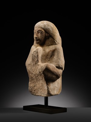 Lot 12 - A RARE EGYPTIAN SANDSTONE FRAGMENT OF A STELOPHOROUS STATUE DEPICTING AN IRY-PAT, NEW KINGDOM, 19TH DYNASTY