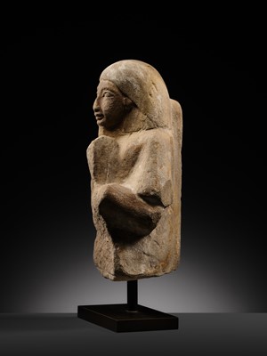 Lot 12 - A RARE EGYPTIAN SANDSTONE FRAGMENT OF A STELOPHOROUS STATUE DEPICTING AN IRY-PAT, NEW KINGDOM, 19TH DYNASTY