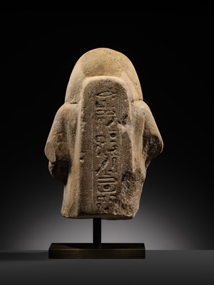 Lot 12 - A RARE EGYPTIAN SANDSTONE FRAGMENT OF A STELOPHOROUS STATUE DEPICTING AN IRY-PAT, NEW KINGDOM, 19TH DYNASTY