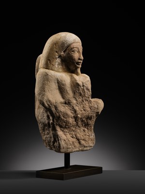 Lot 12 - A RARE EGYPTIAN SANDSTONE FRAGMENT OF A STELOPHOROUS STATUE DEPICTING AN IRY-PAT, NEW KINGDOM, 19TH DYNASTY