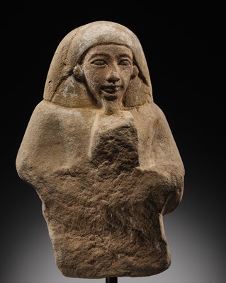 Lot 12 - A RARE EGYPTIAN SANDSTONE FRAGMENT OF A STELOPHOROUS STATUE DEPICTING AN IRY-PAT, NEW KINGDOM, 19TH DYNASTY