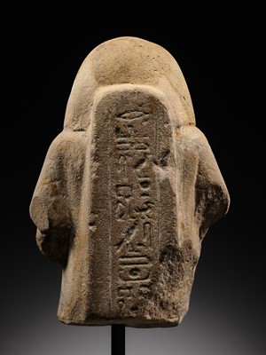 Lot 12 - A RARE EGYPTIAN SANDSTONE FRAGMENT OF A STELOPHOROUS STATUE DEPICTING AN IRY-PAT, NEW KINGDOM, 19TH DYNASTY