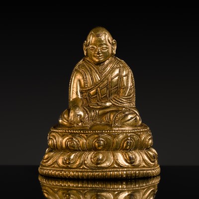 Lot 303 - A SMALL GILT-BRONZE FIGURE OF LAMA SHANG, 15TH-16TH CENTURY