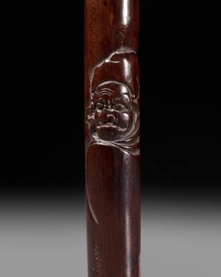 Lot 58 - KOKEI: A RARE AND LARGE WOOD KISERUZUTSU (PIPE CASE) DEPICTING DARUMA