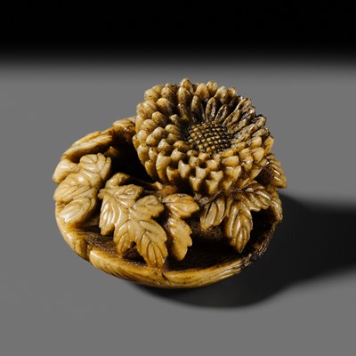 Lot 330 - A FINE ANTLER RYUSA MANJU NETSUKE OF A CHRYSANTHEMUM IN A BASKET