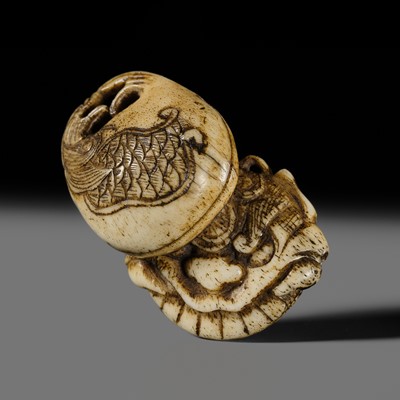 A FINE ANTLER NETSUKE OF TWO MOKUGYO