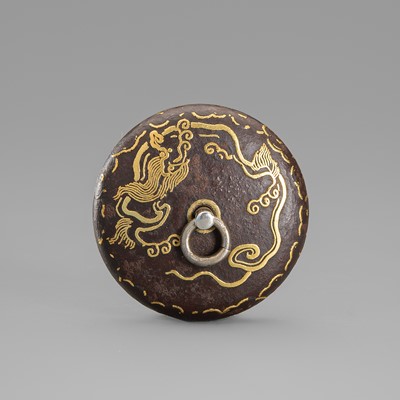 A LACQUERED IRON ASHTRAY NETSUKE DEPICTING SCROLLING PATTERNS