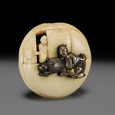Lot 324 - A RARE METAL-INLAID WALRUS TUSK RYUSA MANJU NETSUKE DEPICTING THE CAPTURE OF A BAKEMONO