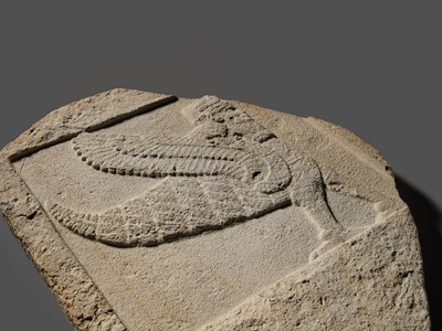 Lot 64 - AN EXTREMELY RARE AND IMPORTANT SANDSTONE RELIEF FRAGMENT DEPICTING A SCORPION-MAN, GIRTABLULLÛ, NEO-BABYLONIAN, 8TH-6TH CENTURY BC
