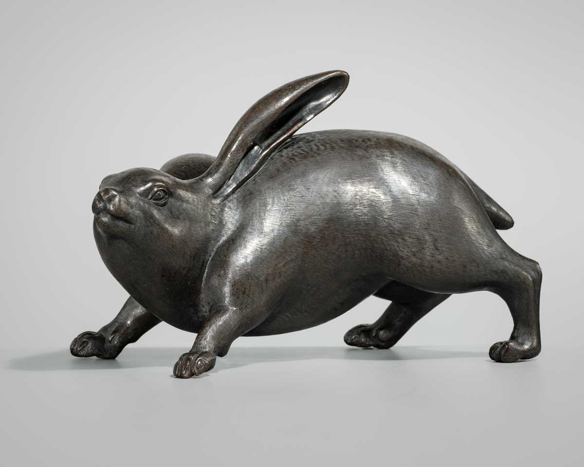 Lot 7 - KAKUUNSAI: A RARE AND CHARMING BRONZE OKIMONO OF A HARE