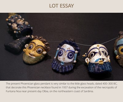 Lot 60 - A CARTHAGINIAN GLASS HEAD PENDANT, CIRCA 5TH-4TH CENTURY BC