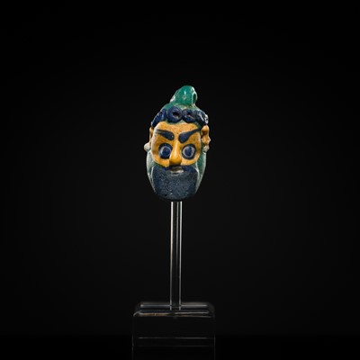 Lot 60 - A CARTHAGINIAN GLASS HEAD PENDANT, CIRCA 5TH-4TH CENTURY BC