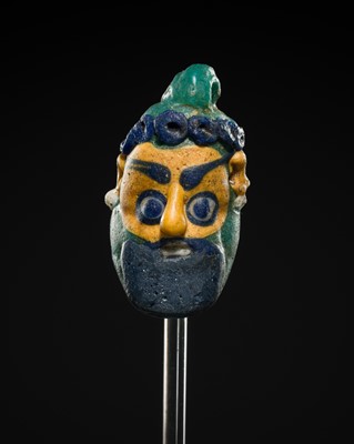Lot 60 - A CARTHAGINIAN GLASS HEAD PENDANT, CIRCA 5TH-4TH CENTURY BC