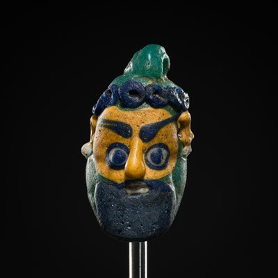 Lot 60 - A CARTHAGINIAN GLASS HEAD PENDANT, CIRCA 5TH-4TH CENTURY BC