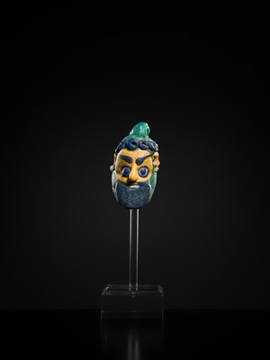 Lot 60 - A CARTHAGINIAN GLASS HEAD PENDANT, CIRCA 5TH-4TH CENTURY BC
