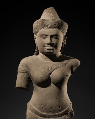 Lot 263 - A LARGE SANDSTONE FIGURE OF UMA, ANGKOR WAT STYLE