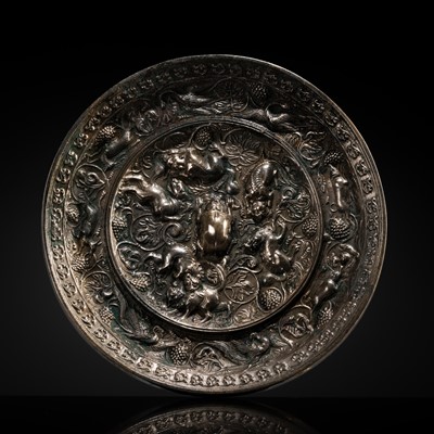 Lot 93 - A SILVERED BRONZE ‘LION AND GRAPEVINE’ MIRROR, TANG DYNASTY