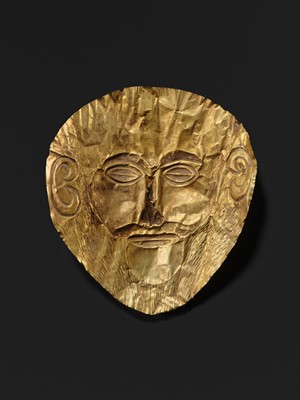 Lot 86 - AN EXPRESSIVE AND FINELY WORKED FUNERARY MASK OF A MAN, WESTERN ASIA, POSSIBLY 2ND–1ST MILLENNIUM BC