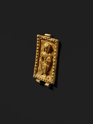 A GOLD REPOUSSÉ PENDANT OF PADMAPANI, ANCIENT REGION OF GANDHARA