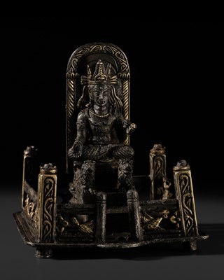 Lot 296 - AN UNUSUAL PARCEL-GILT SILVER ALLOY FIGURE OF BUDDHA ON A LION THRONE