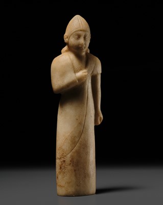 Lot 307 - A FINE ALABASTER FIGURE OF A MALE VOTARY, ARCHAIC CYPRUS STYLE