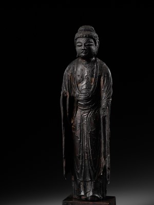 AN EARLY CARVED CYPRESS WOOD FIGURE OF AMIDA NYORAI, HEIAN PERIOD