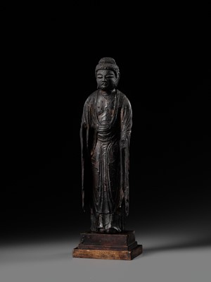 AN EARLY CARVED CYPRESS WOOD FIGURE OF AMIDA NYORAI, HEIAN PERIOD