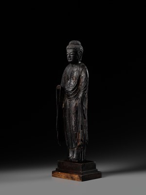 AN EARLY CARVED CYPRESS WOOD FIGURE OF AMIDA NYORAI, HEIAN PERIOD
