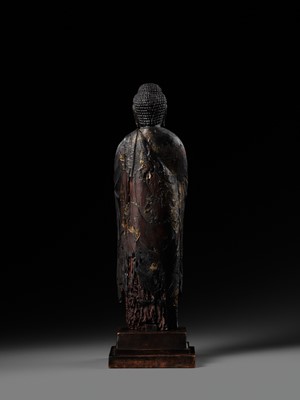 AN EARLY CARVED CYPRESS WOOD FIGURE OF AMIDA NYORAI, HEIAN PERIOD