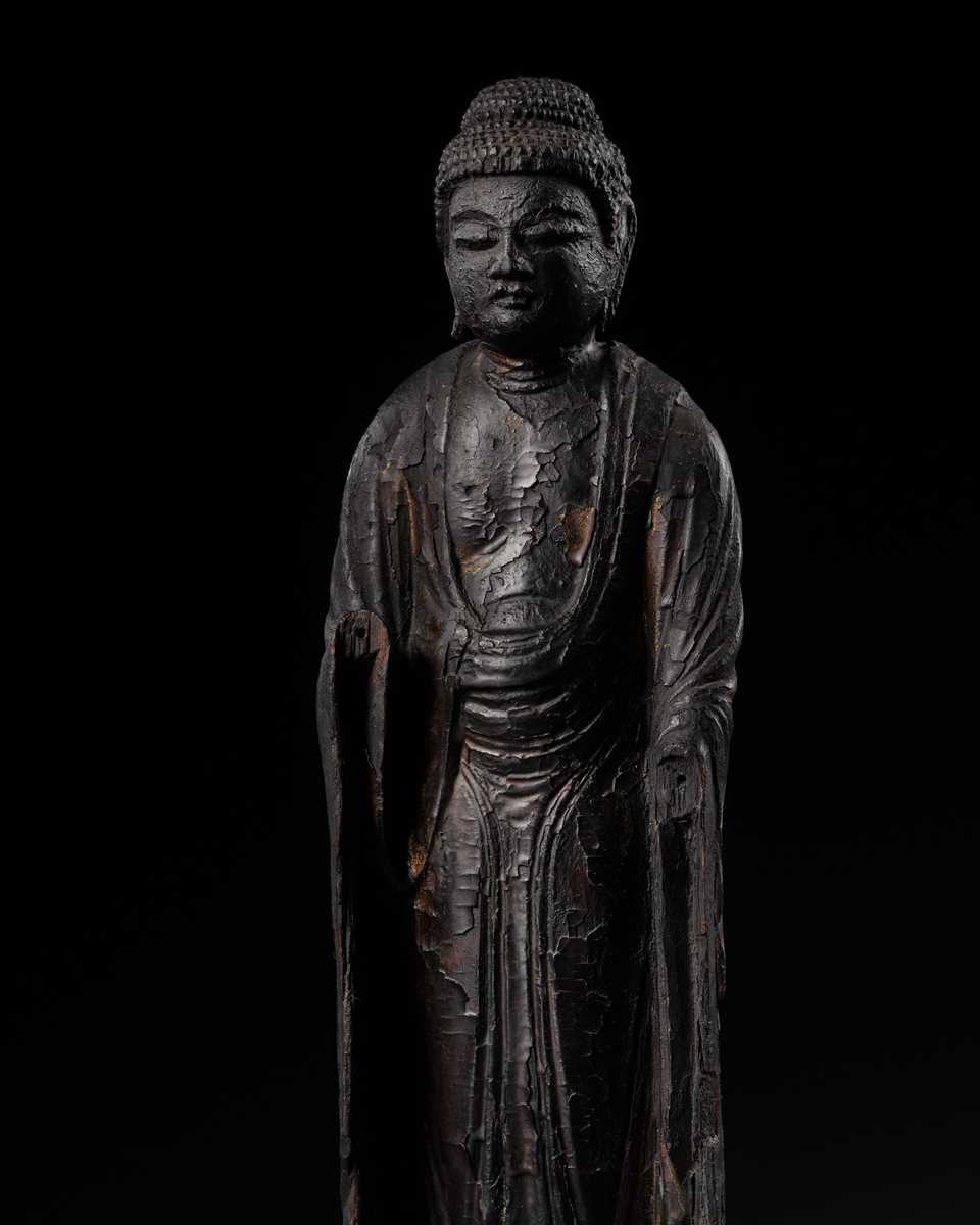 AN EARLY CARVED CYPRESS WOOD FIGURE OF AMIDA NYORAI, HEIAN PERIOD