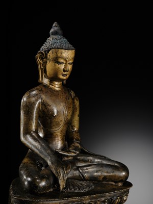 Lot 11 - AN IMPORTANT PARCEL-GILT COPPER ALLOY FIGURE OF BUDDHA SHAKYAMUNI, TIBET, 13TH-14TH CENTURY