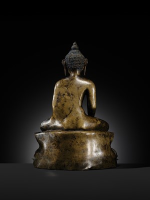 Lot 11 - AN IMPORTANT PARCEL-GILT COPPER ALLOY FIGURE OF BUDDHA SHAKYAMUNI, TIBET, 13TH-14TH CENTURY