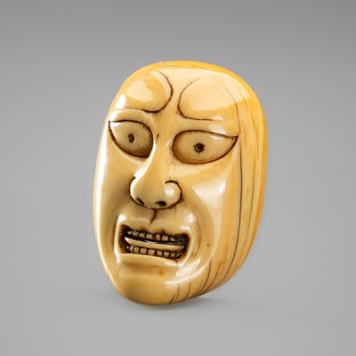 Lot 735 - AN IVORY NOH MASK NETSUKE