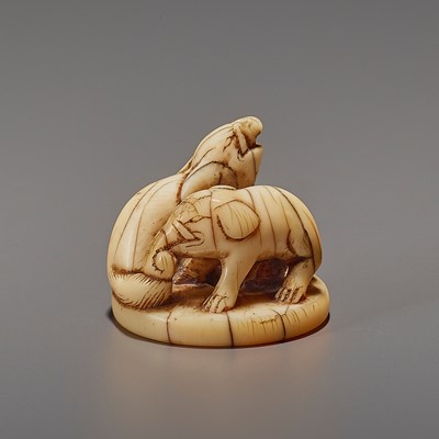 Lot 79 - A RARE AND EARLY IVORY NETSUKE OF AN ELEPHANT AND BAKU