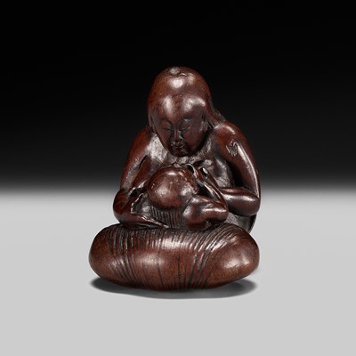 Lot 229 - MASAKAZU: A FINE NAGOYA SCHOOL WOOD NETSUKE OF A NINGYO (MERMAID) AND CHILD