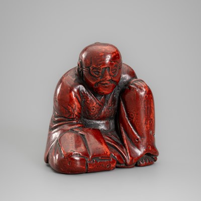 MASAYOSHI: A TSUISHU LACQUER NETSUKE OF A PRIEST