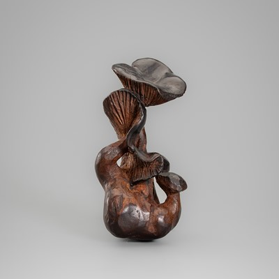 A WOOD NETSUKE DEPICTING A GROUP OF MUSHROOMS