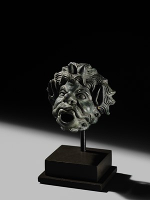 Lot 77 - A ROMAN BRONZE WATER SPOUT DEPICTING PAN, PROBABLY FROM A NYMPHAEUM, CIRCA 1ST–2ND CENTURY