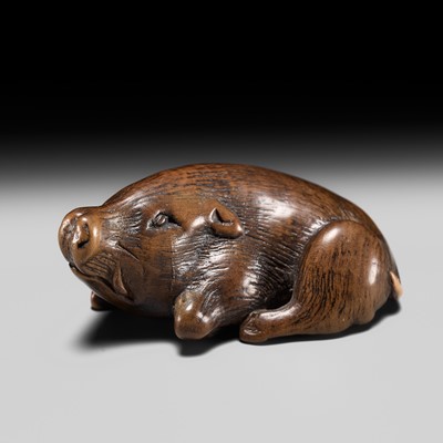 Lot 204 - ICHIUN: A FINE WOOD NETSUKE OF A RECUMBENT BOAR