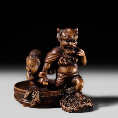 Lot 157 - SUKETADA: A WOOD NETSUKE OF RAIJIN BATHING WITH A WOMAN