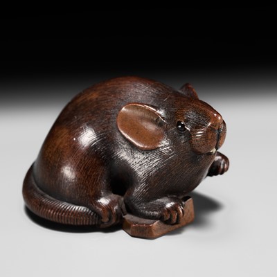 Lot 191 - IKKAN: A FINE WOOD NETSUKE OF A RAT WITH A SHOGI TILE