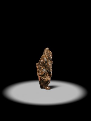 Lot 90 - A POWERFUL SAISHIKI NETSUKE OF SHOKI, ATTRIBUTED YOSHIMURA SHUZAN