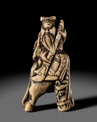 Lot 312 - AN ANTLER NETSUKE OF KAN’U ON HORSEBACK