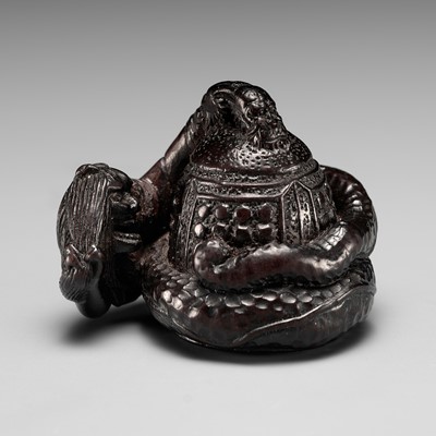 A GOOD TSU SCHOOL EBONY WOOD NETSUKE OF KIYOHIME AND THE DOJOJI BELL